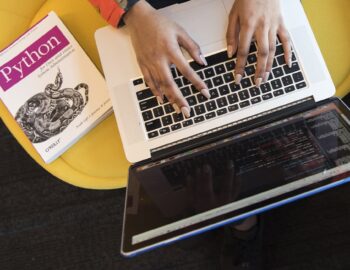 A laptop and a book