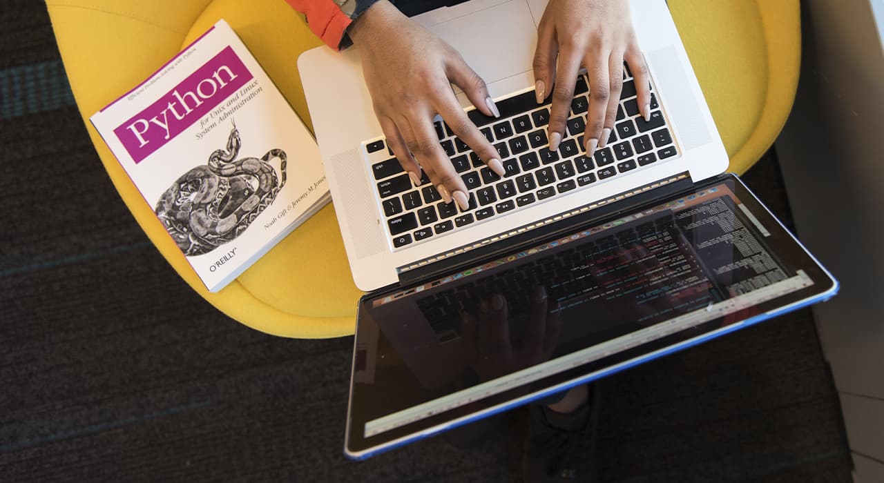 A laptop and a book