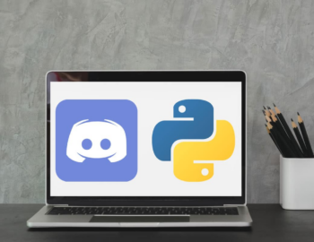 Open laptop with discord and python emblems