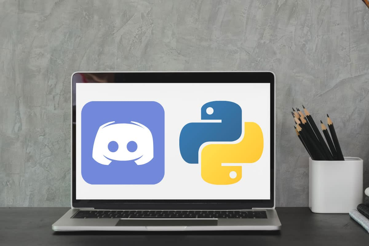 Open laptop with discord and python emblems