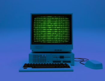 computer with coding on it, computer mouse, and keyboard in blue light